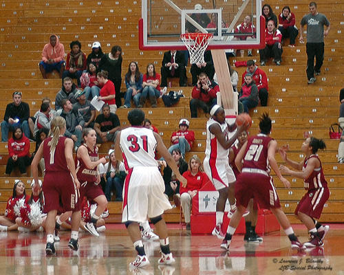 Nikkia Smith pulls in the rebound after Cherelle Moore's missed shot